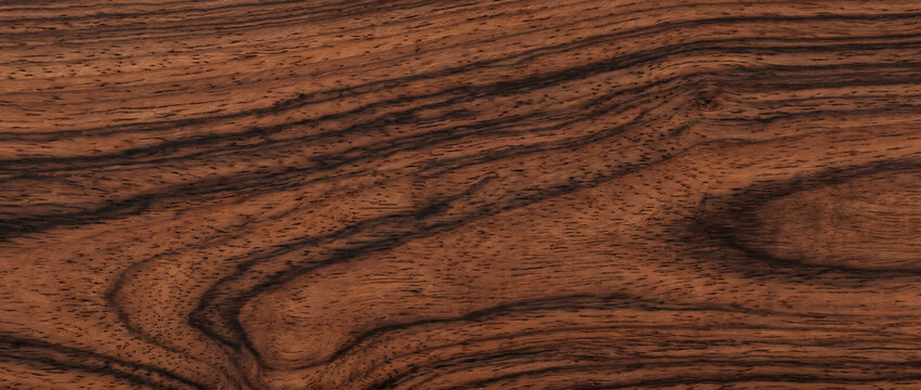 Bubinga wood texture with rich reddish brown exotic grain seamless premium hardwood background