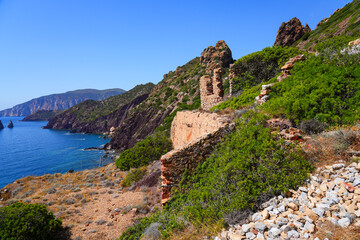 Fototapeta premium Historic ruins of the Laveria Lamarmora mining complex perched on the cliffs of Nebida overlooking the Mediterranean Sea, Sardinia, Italy