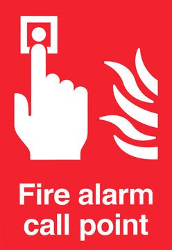 Finger pressing red fire alarm call point with white flames symbol on a bright background