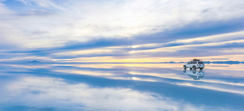 Salar de Uyuni, a vast white expanse of the Salar de Uyuni, the world&rsquo;s largest salt flat, under a clear blue sky in the Andean region of Bolivia.