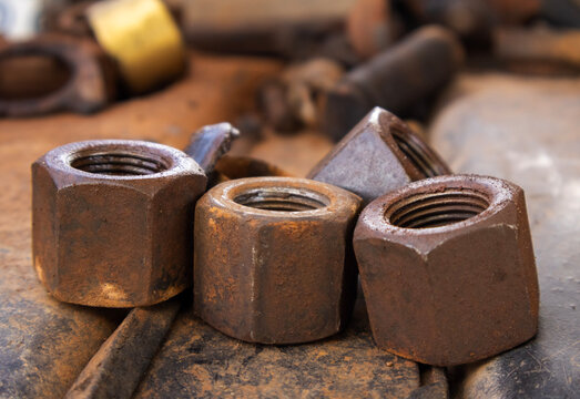 Close-up on rusty big nuts