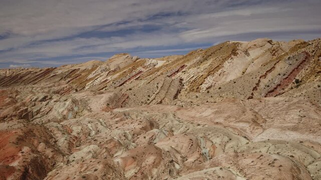 Aerial Flyover of a sandstone canyon and cliffs near the San Rafel Reef, Utah