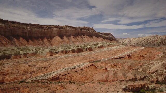 Aerial Flyover of a sandstone canyon and cliffs near the San Rafel Reef, Utah