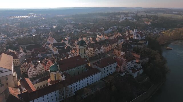 Panoramic city skyline of Neuburg an der Donau in Upper Bavaria featuring the historic Hofkirche monument on the town square under a beautiful clear horizon line during daytime