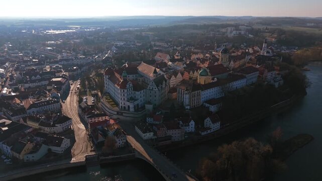 Scenic aerial vista over the historical Karlsplatz square in Neuburg an der Donau displaying the impressive architectural icon of Hofkirche palace church in Upper Bavaria