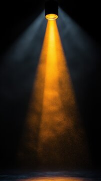 Single spotlight illuminating misty haze on empty dark stage