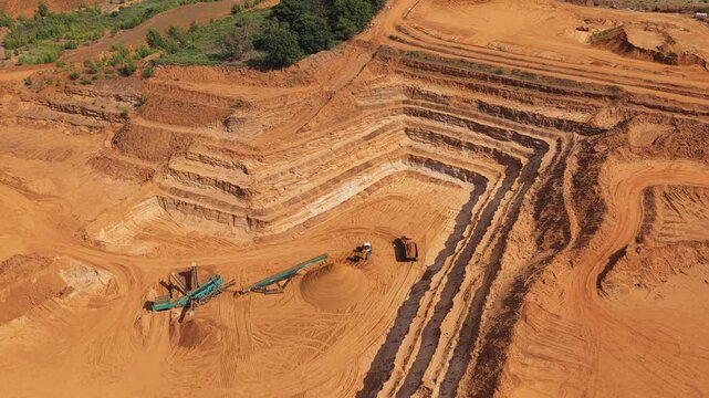 Industrial Open-Pit Mine Shows Heavy Equipment and Conveyor Belts