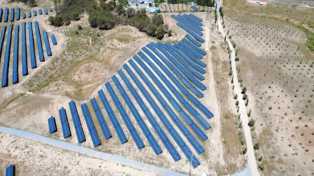 Aerial view of solar panels farm producing renewable energy