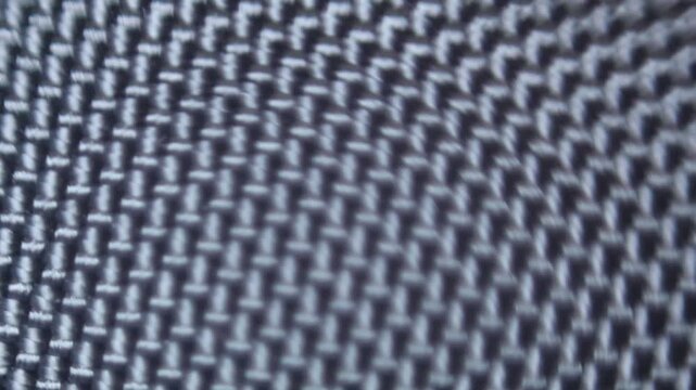 Macro video of interwoven premium fabric with a high level of detail and variable focus