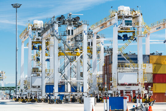 Canada, BC, Delta.  Shipping containers and container cranes at Deltaport, a deepwater port on the Georgia Strait, 35km south of Vancouver.