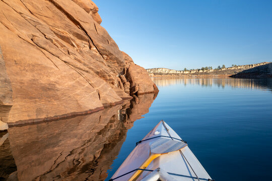 Horsetooth Reservoir at foothills of Rocky Mountains in northern Colorado - POV from expedtion canoe in warm winter scenery