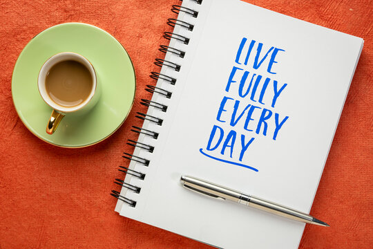 Live Fully Every Day - inspirational handwritten message in a spiral sketchbook with coffee and pen, encouraging purpose, gratitude, joy, and intentional living.