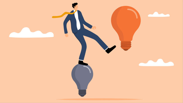 Businessman balancing on lightbulbs representing innovation and creativity