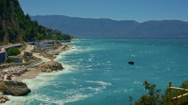 Scenic Coastline View Of Turquoise Sea Water With Waves And Rocks. Mediterranean Coastal Promenade Beach. Summer Vacation Travel