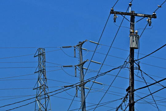 Three generations of high voltage electrical transmission poles and pylons 