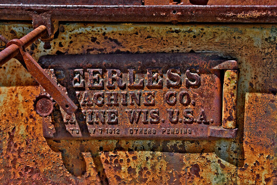 Metal badge of Peerless Machine Company, on 1912 industrial saw, Gold Country, Sierra Nevada Foothills, California 