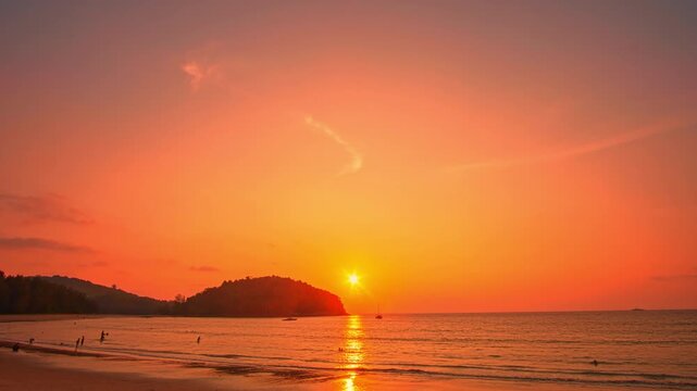 Time lapse Waves kiss the sandy beach while the fading sunlight creates a warm, romantic glow over the horizon. Serene Paradise Sunset by the Sea at Kala island Layan beach Phuket