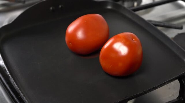 Tomato Roasting on a Hot Griddle for Traditional Mexican Salsa