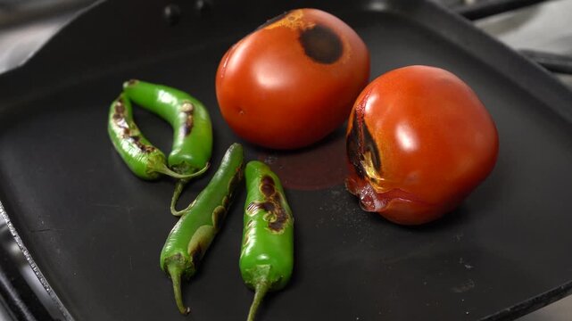 Tomato and Chili Roasting on a Hot Griddle for Traditional Mexican Salsa