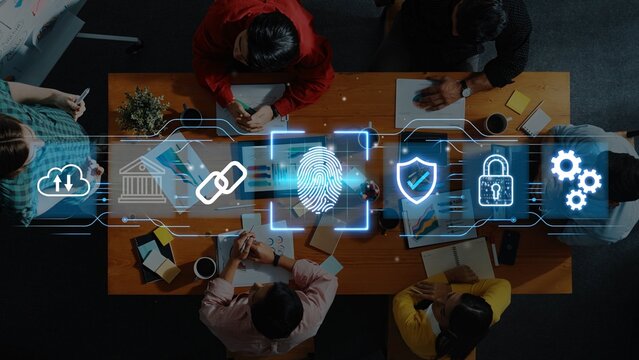 Group of Diverse Professionals Collaborating on Cybersecurity Strategy with Technology Icons Showcasing Digital Security and Data Protection Concepts. Entropy.
