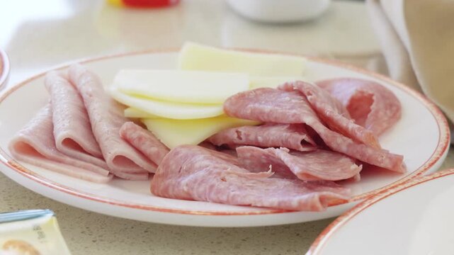 Cold cut platter with sliced ham salami and Swiss cheese