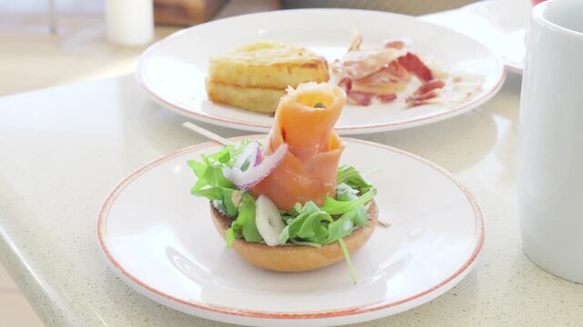 Smoked salmon roll on open face toasted bagel brunch