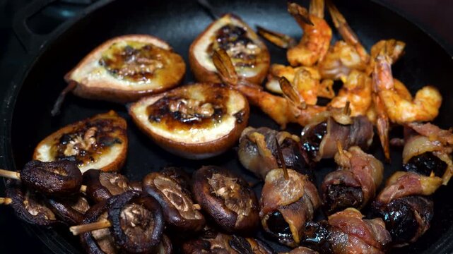 Top View of Figs and Mushroom Skewers in a Cast Iron Skillet
