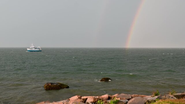 Groton, Connecticut, USA &ndash; Fishing Boat Beneath Double Rainbow During Coastal Storm