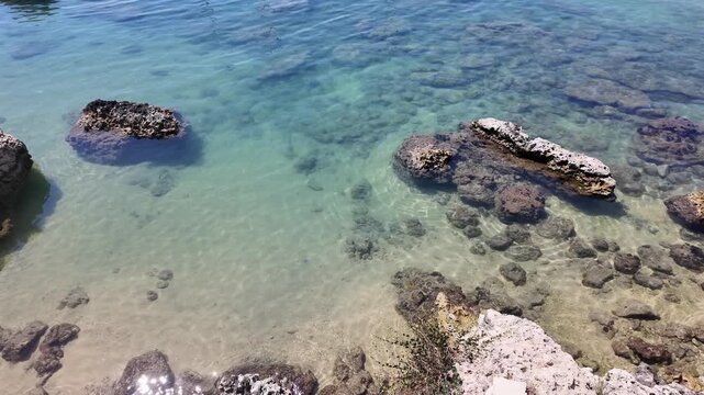 Rock formations in shallow water no action observed static scene, in shallow coastal area with clear blue water and, with rock formations, clear blue water, rocky seabed, with rocks, water texture.
