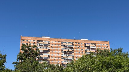 Apartment Building Amidst Greenery © Maria