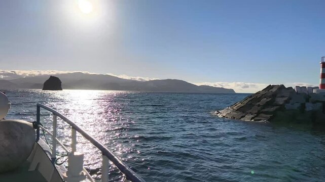 Azores, Portugal. Passenger ferry crossing the Atlantic Ocean from Pico to Faial Island with scenic coastal views and the beautiful volcanic landscapes of the Azores.
