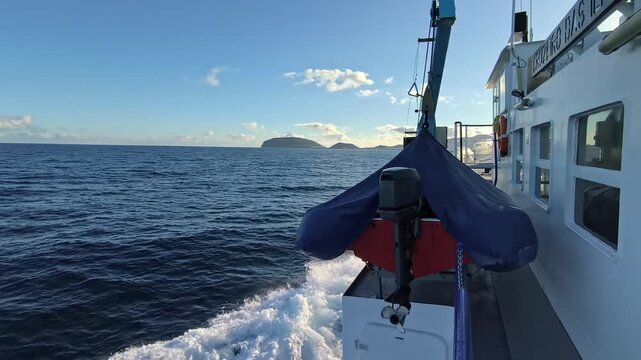 Azores, Portugal. Passenger ferry crossing the Atlantic Ocean from Faial to Pico Island with scenic coastal views and the beautiful volcanic landscape of the Azores.