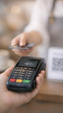 A handheld electronic payment processing device for credit cards and mobile payments.