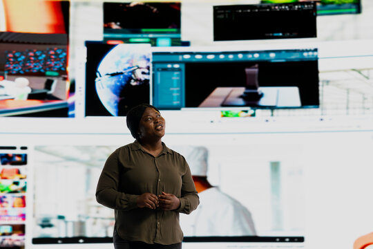 Joyous woman satisfied by immersive technology interaction with video content. Happy viewer thrilled to browse through stream of social media updates representing hyperconnected culture concept.