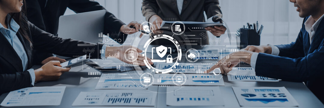 Business Team Collaborating on Data Analysis in Modern Office with Cybersecurity Graphics and Financial Reports on Table. Entropy.