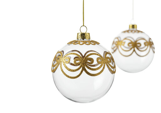 Three elegant, clear hand-blown glass christmas baubles detailed with 24k gold filigree, hanging staggered on a stark white background with rim light, luxury product advertising concept