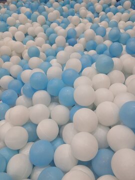 Full frame of colorful plastic balls in a kids ball pit playground.