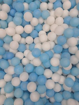 Full frame of colorful plastic balls in a kids ball pit playground.