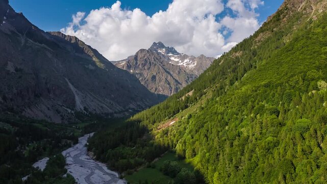 Aerial view of Ecrins National Park in the Hautes-Alpes, French Alps. Timelpase of Champoleon Valley and Sirac alpine mountain peak. France