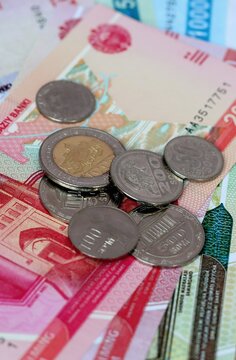 Uzbekistani som money bills and coins on table. Uzbekistan cash of UZS currency close up