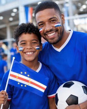 Cape verdean father and son celebrating world cup watching soccer sport together