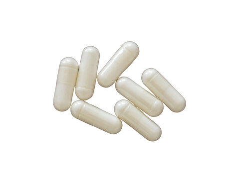 Varias capsulas  de color blanco colocadas en un fondo transparente 