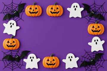 Obraz premium Decorative Halloween Elements Border With Ghosts Pumpkins Bats and Spiders on Purple Background