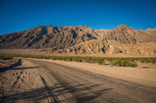 Mountains along the Badwater Basin in Death Valley National Park at sunset.  California, USA.