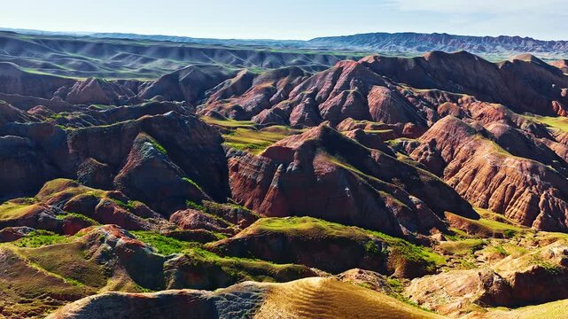Scenic view of colourful Danxia landform mountains with mineral layers in Xinjiang, China.