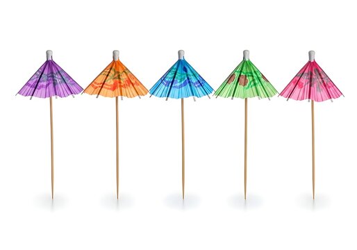 Five colorful party umbrellas in a row for drinks