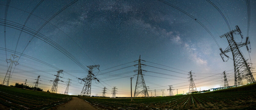 The high voltage tower and the Milky Way at night