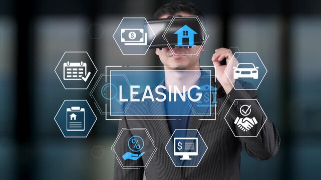 Professional man wearing virtual reality headset exploring leasing concepts with digital icons and overlays in a modern office environment. Entropy.