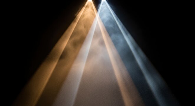 Light beams shining through darkness.