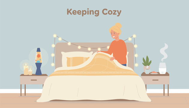 Young smiling woman tucking in cozy warm bed with string lights, essential oil diffuser, and lava lamp in bedroom.